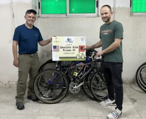 Photo from Paul Demers blog: poster and Vermont bikes at Absolute Bikes Tirana Albania