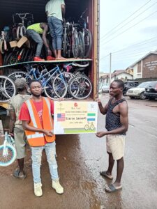 Sierra Leone unloading with poster, September 2024