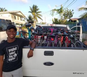 Kevaun Mckesey with bikes in Belize